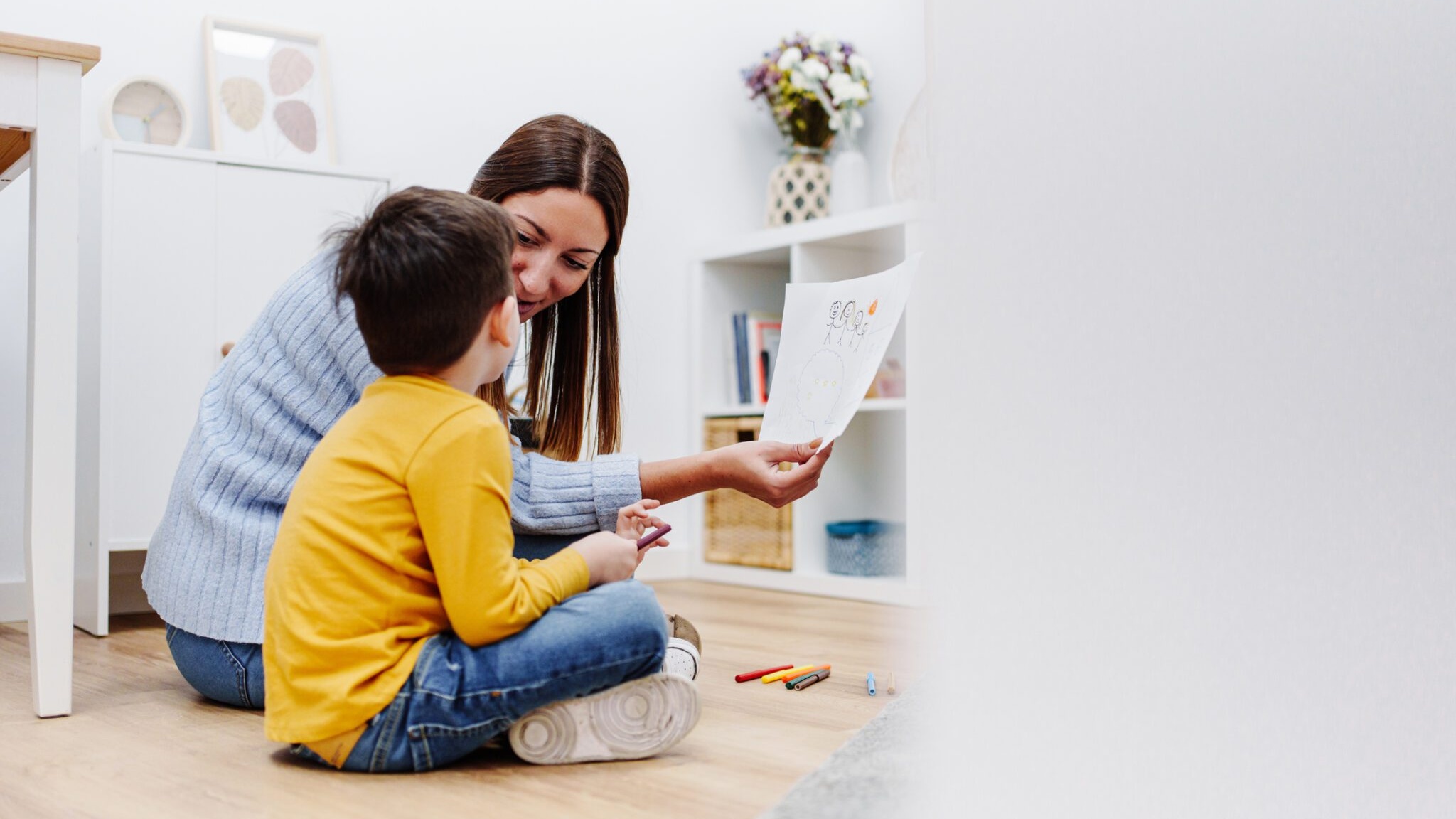 Support worker helping a child with disabilities in a nurturing home setting